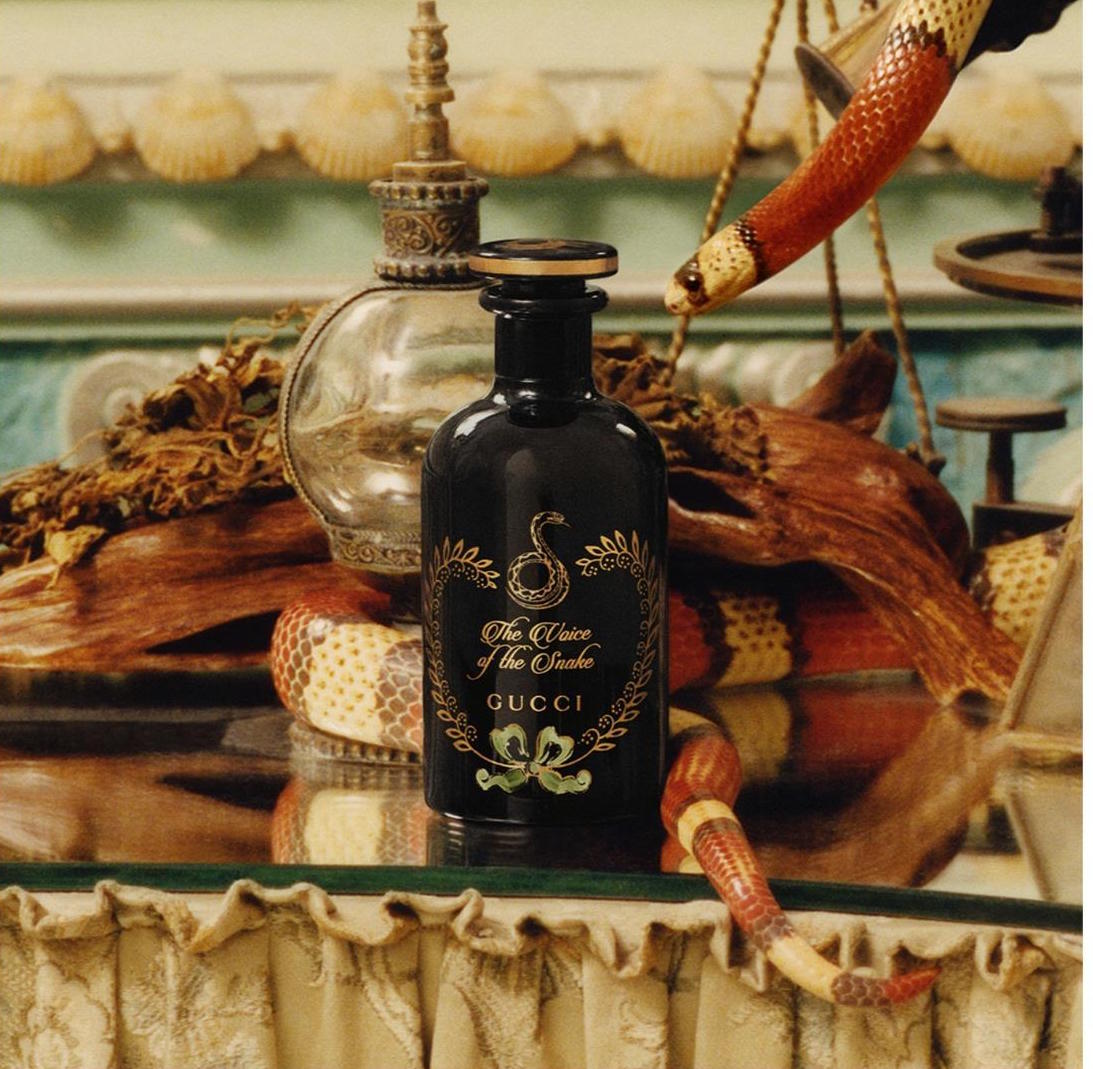 perfume with snake around bottle